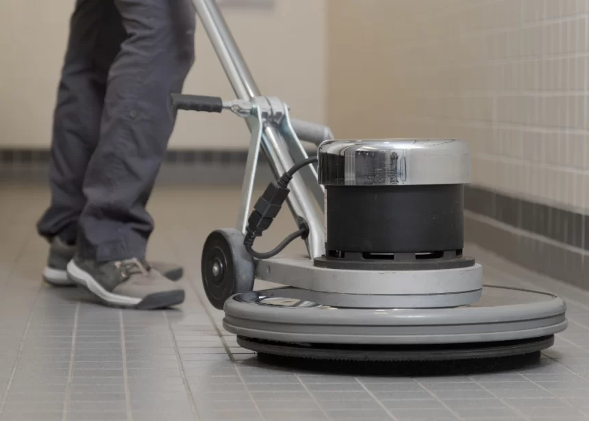 close up of buffer cleaning a bathroom floor
